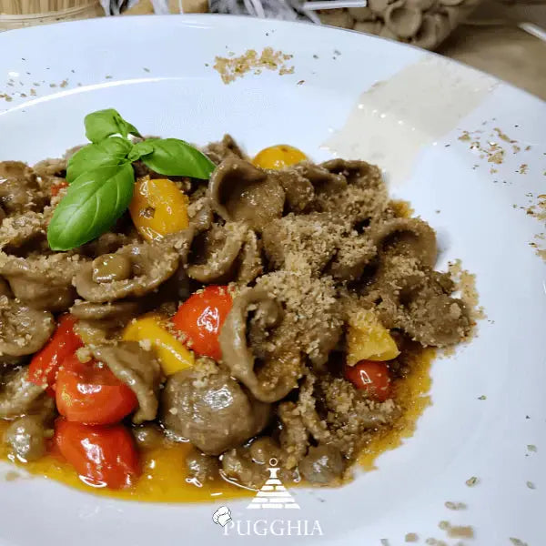 alt="Orecchiette di grano arso con pomodorini gialli e rossi